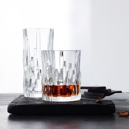 The NACHTMANN series Shu Fa with the longdrink glass and the with whisky filled tumbler on a stone serving tray.<br/>