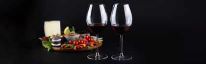 vegetable tray next to RIEDEL red wine glasses