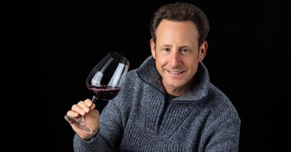 holding RIEDEL red wine glass