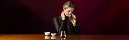 woman smelling the aroma of wine in a RIEDEL The O Wine Tumbler glass