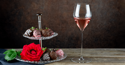 dessert tray next to glass of wine