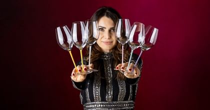 woman holding 6 RIEDEL Fatto a Mano glasses