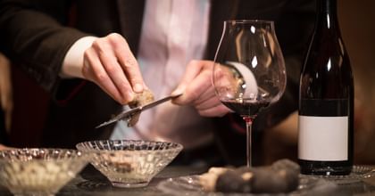 Truffel shaving beside a Pinot Noir Glass