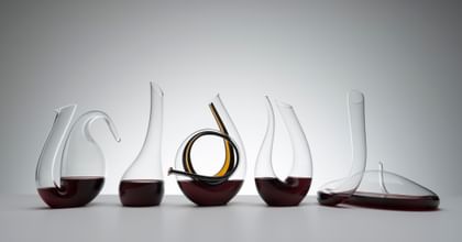 various RIEDEL decanters lined up
