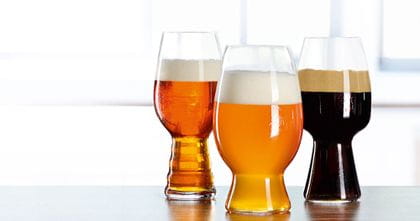 The SPIEGELAU Craft Beer IPA, American Wheat and Stout glass in a row filled with beer.