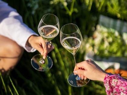 cheering champagne glasses outside