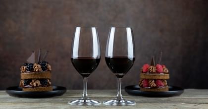 red wine glasses in front of dessert