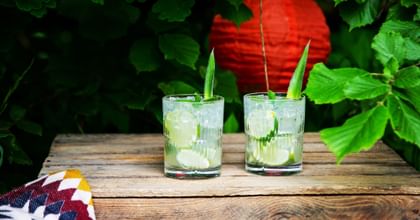 two lime cocktails outside