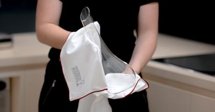 a Riedel decanter is cleaned with a Riedel microfiber cloth
