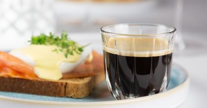coffee next to brunch dish
