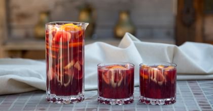pitcher of sangria next to two glasses