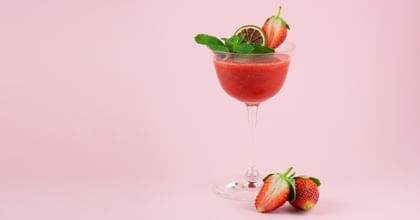 strawberry cocktail with pink background