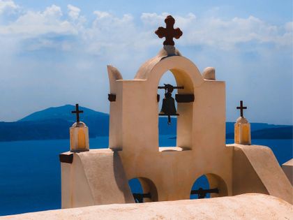 The top of a church overlooking the mediterranean sea.
