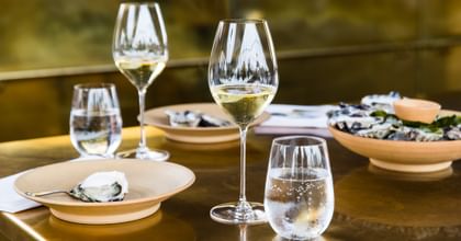 RIEDEL Veritas Champagne glasses filled with Champagne on a set tabletop.