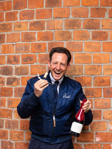 man with wine bottle and glass