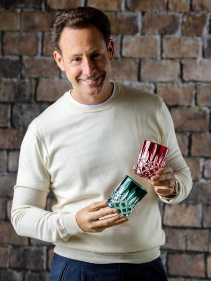 Maximilian J. Riedel holding RIEDEL Laudon glasses