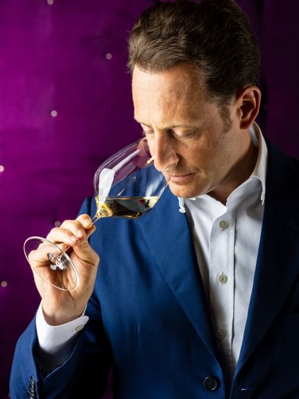 men smelling wine aroma
