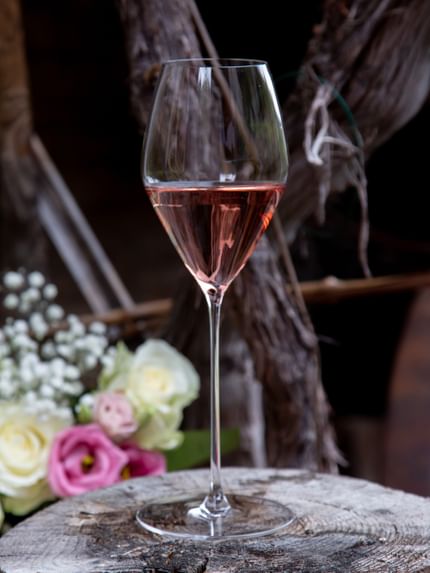  Rosé glass on wooden table