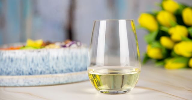 stemless riesling glass next to summery dish