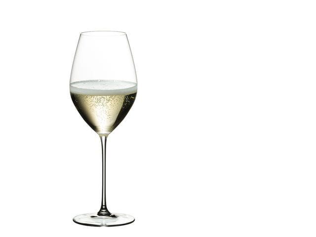 RIEDEL Veritas Champagne Wine glass filled with Champagne on a white background.