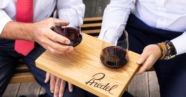 Georg J. Riedel and Maximilian J. Riedel holding RIEDEL stemless glasses