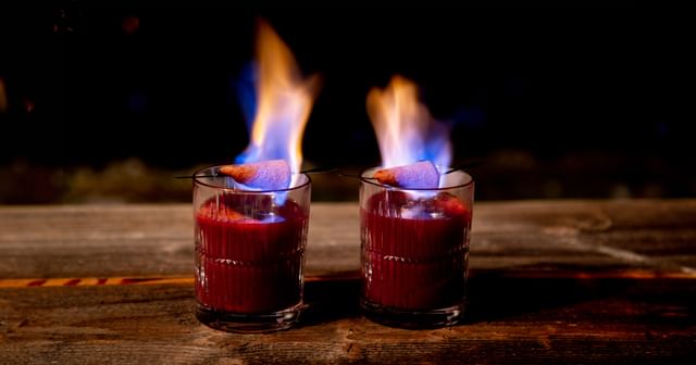 two fire tungs punch cocktails in a Riedel Shadows Tumbler