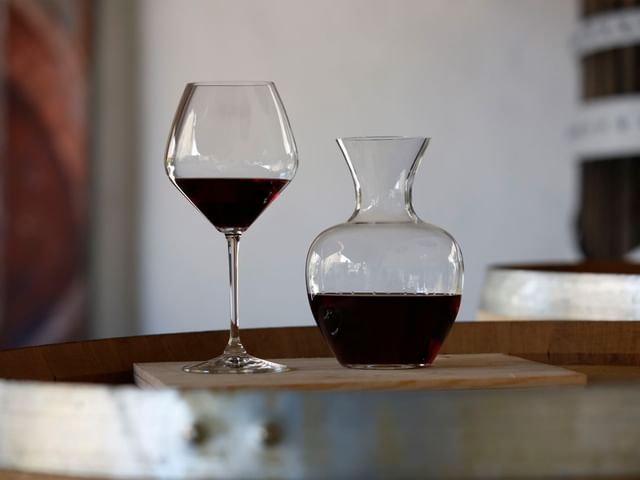 RIEDEL pinot noir glass next to decanter