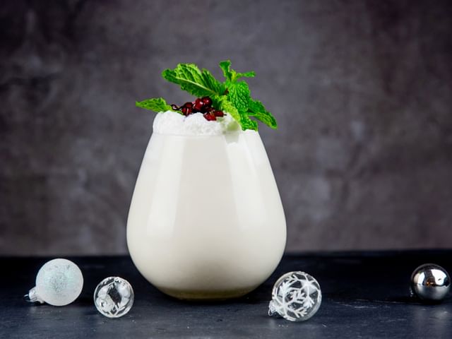 cocktail on table with decorative balls