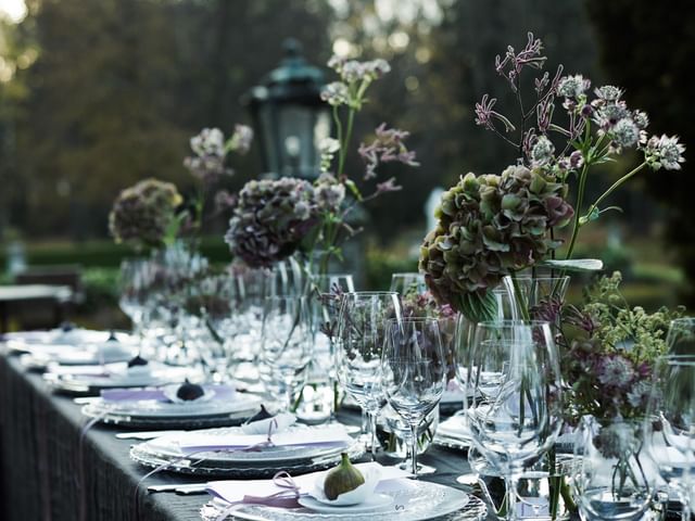 various wine glasses on set table outdoors