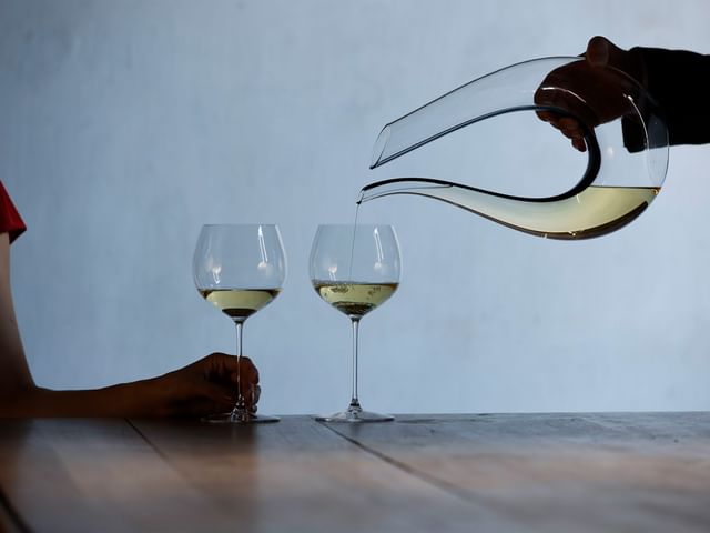 two RIEDEL chardonnay glasses and decanter
