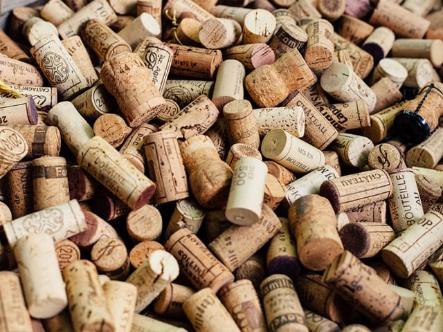 A barrel filled with wine corks.